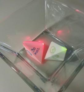 Two completed origami units representing time, each with an LED and an RFID tag inside. (See instructions)